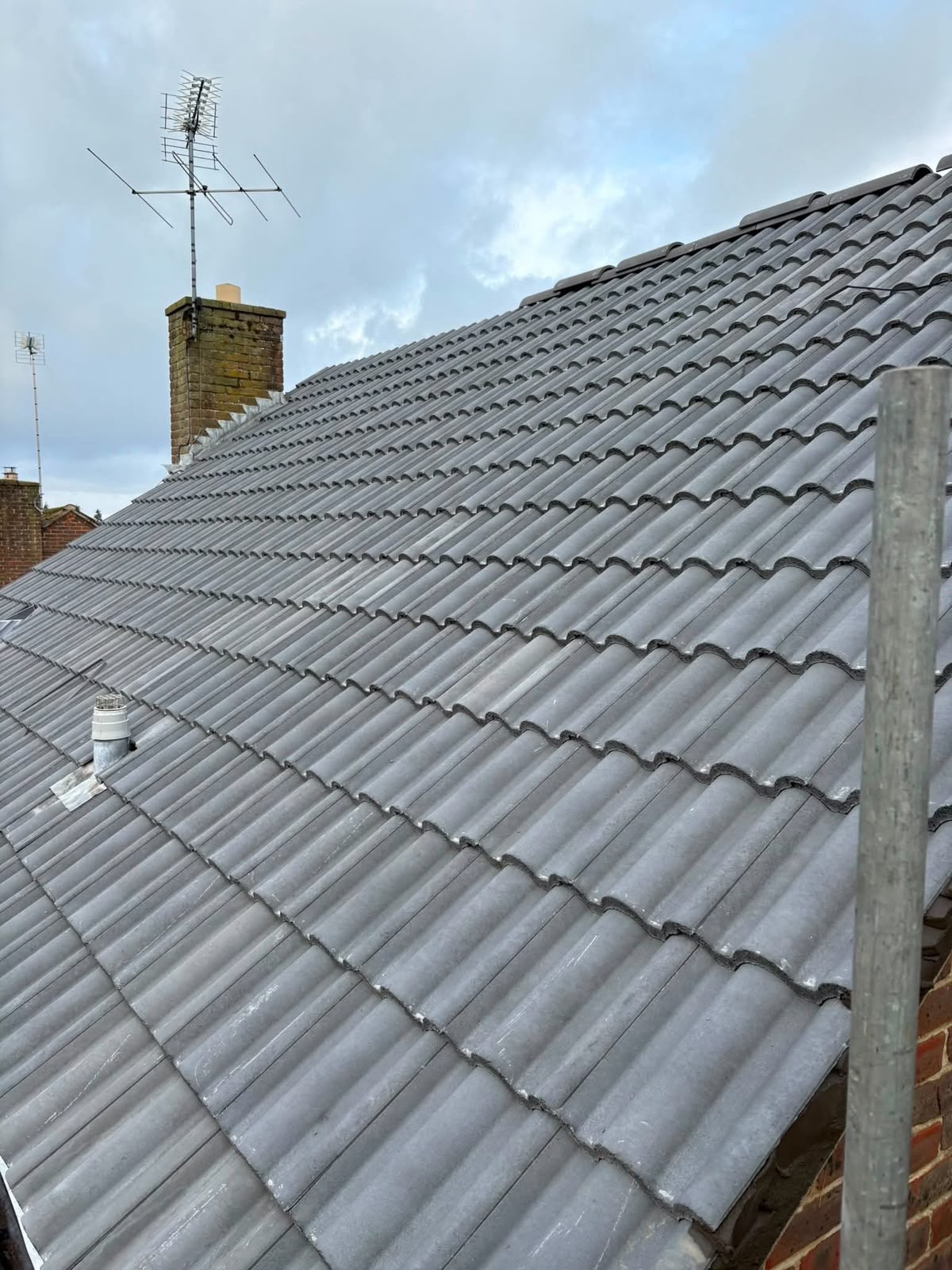 Completed dark grey interlocking tile roof
