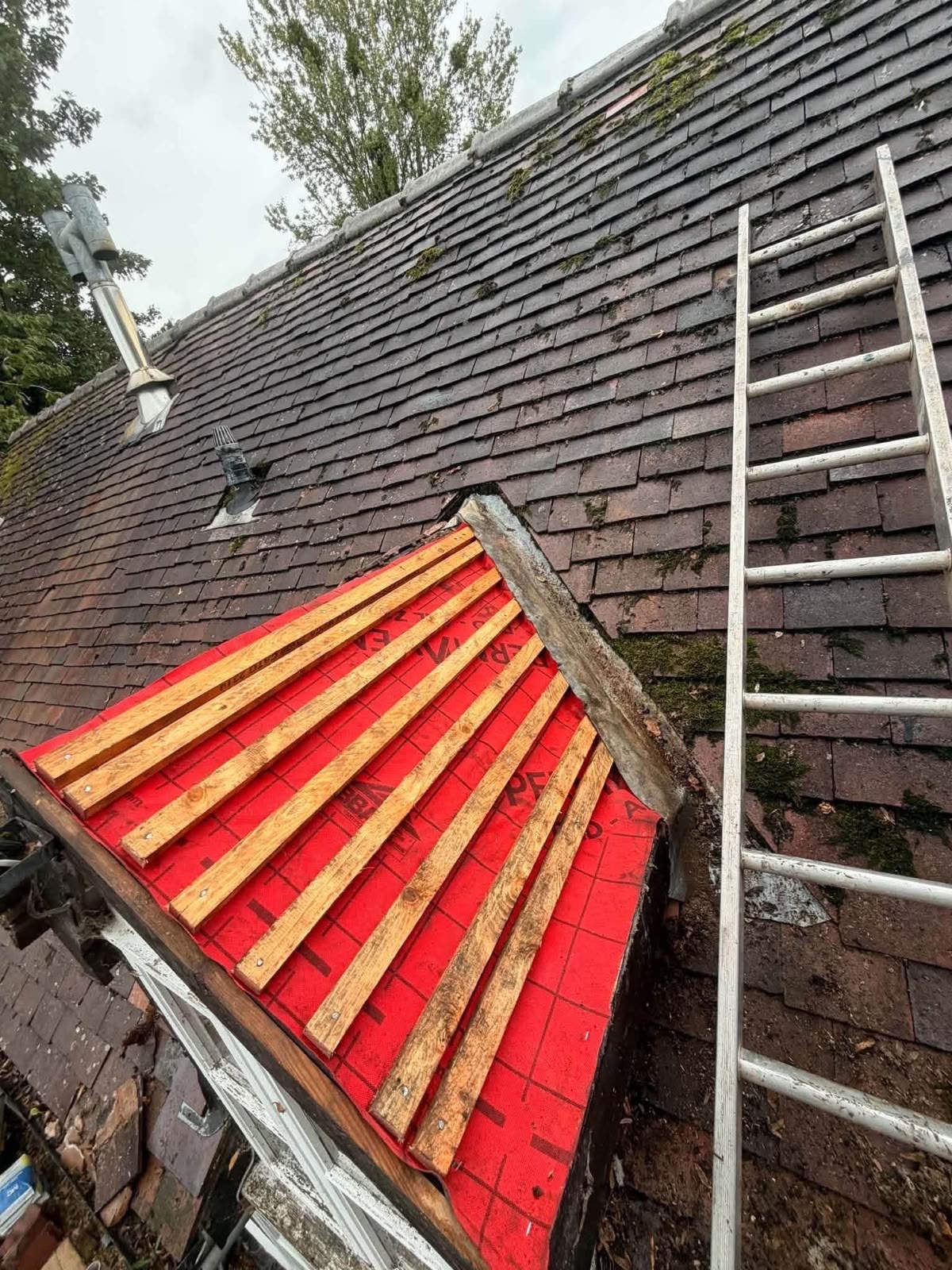 Dormer window re-roof with red underlay